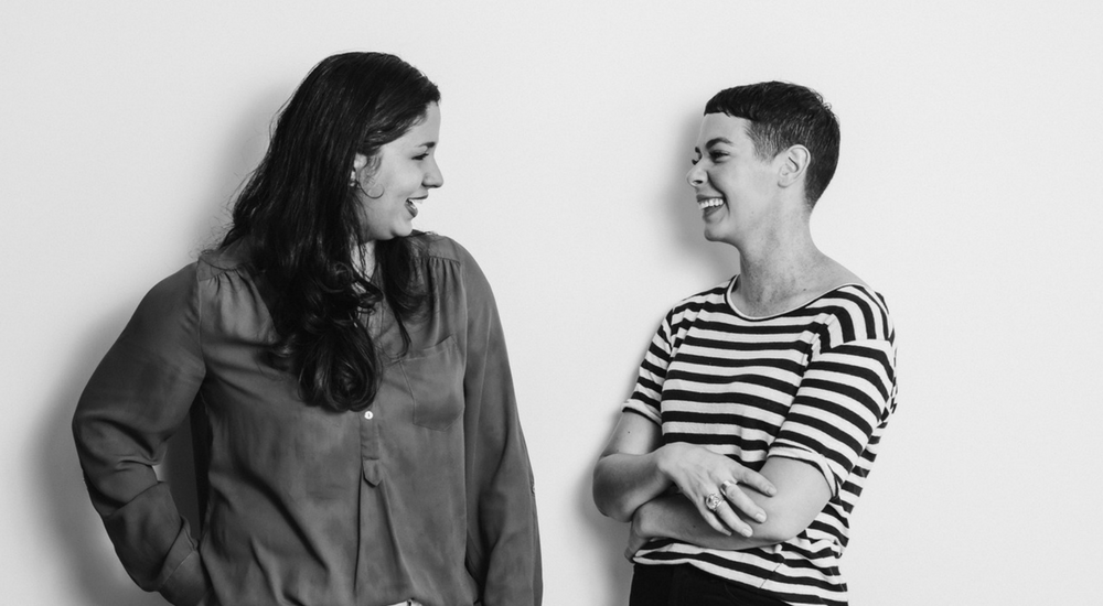 Two women talking and laughing with each other